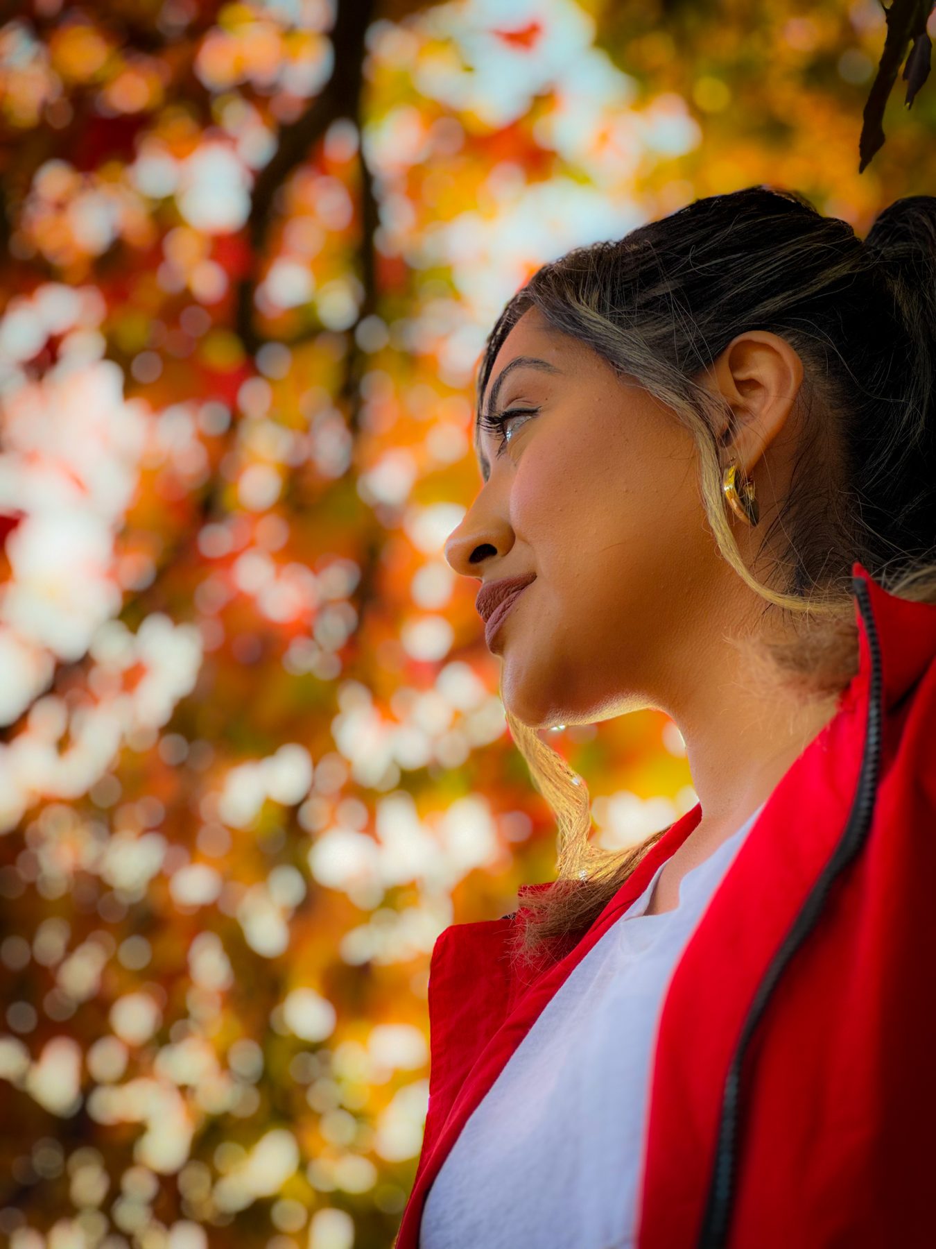 Autumn portrait with golden bokeh